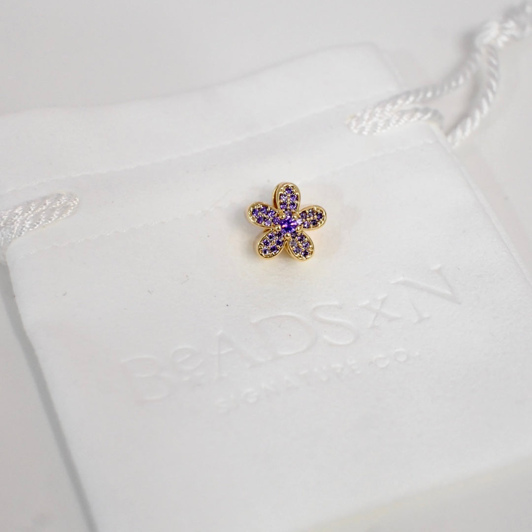THE PURPLE FLOWER CHARM