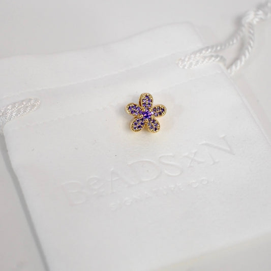 THE PURPLE FLOWER CHARM