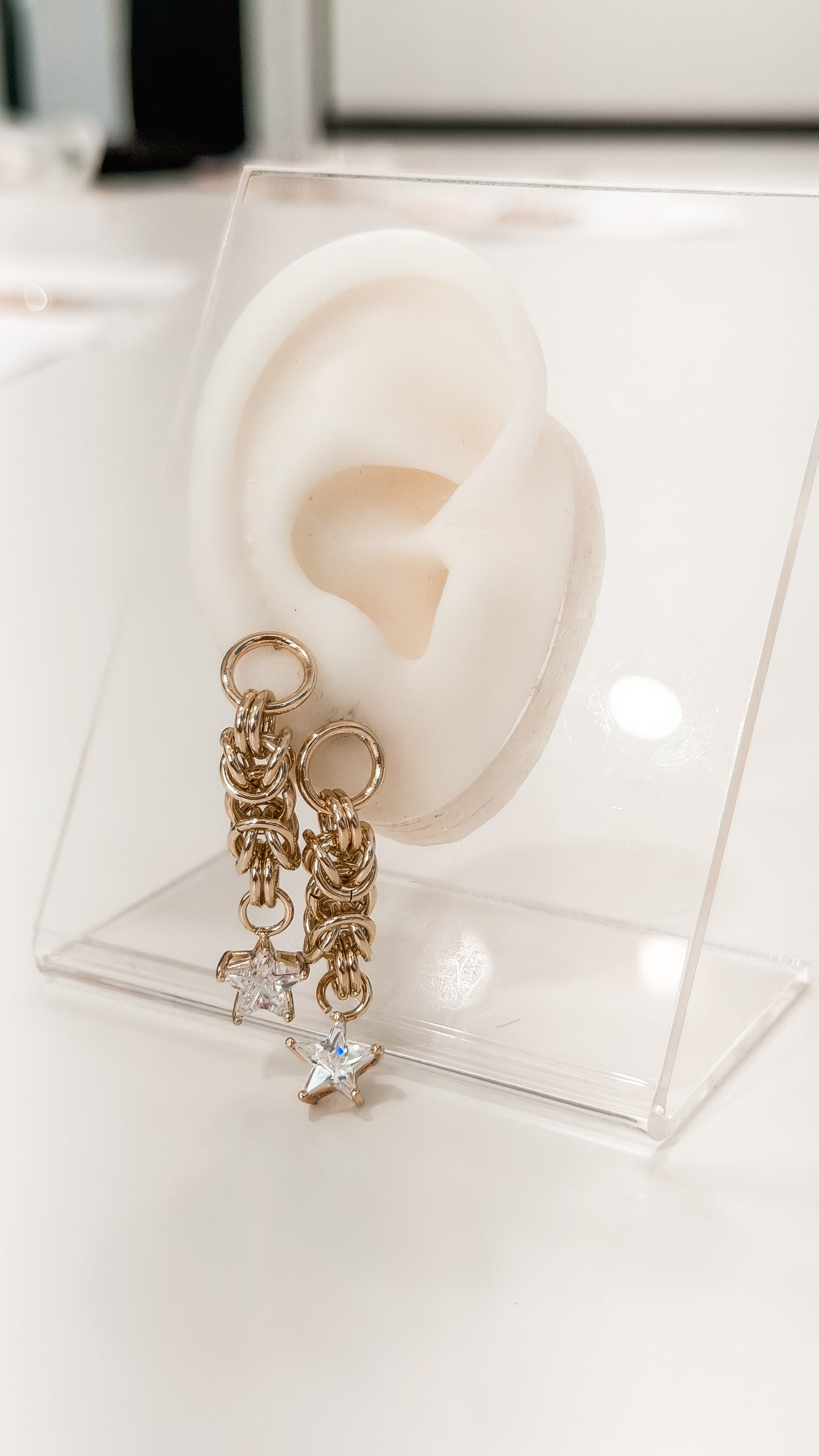 ARETES ESTRELLAS DANGLE